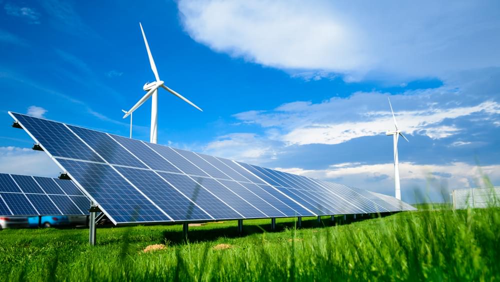 Photovoltaic panels with wind turbines