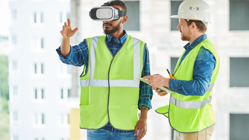 Construction workers using virtual reality headset