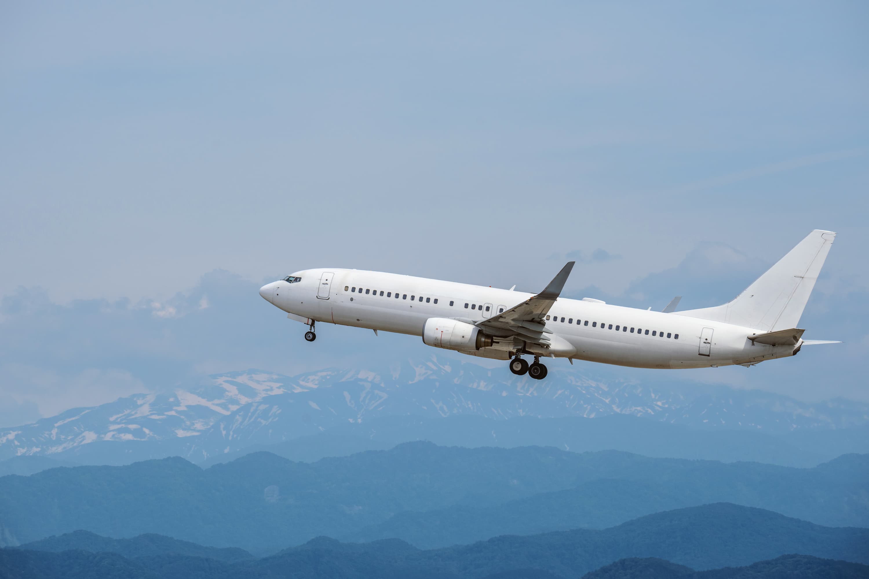 Aeroplane flying over mountains