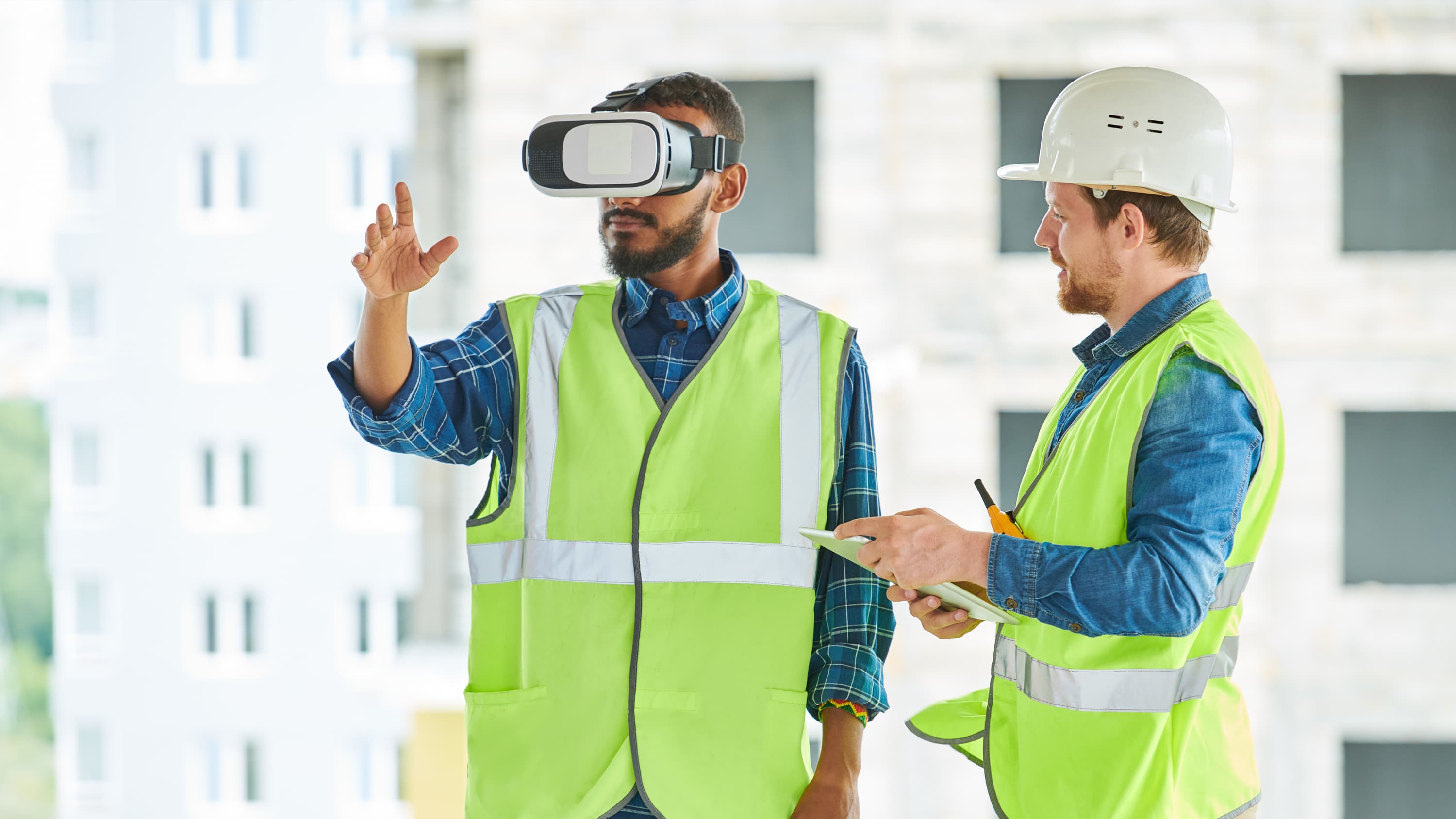Construction worker wearing virtual reality headset