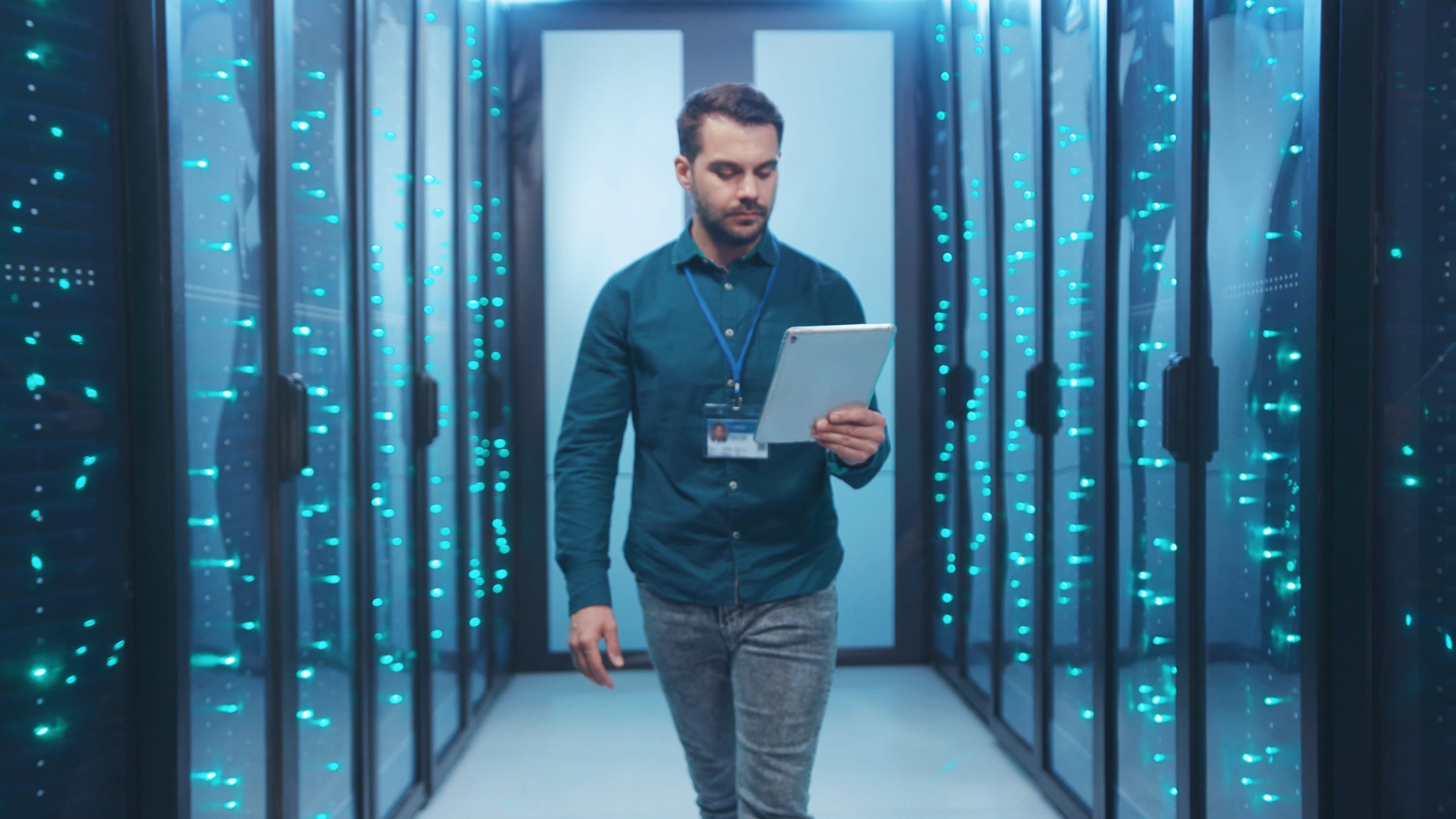 Man walking through data centre