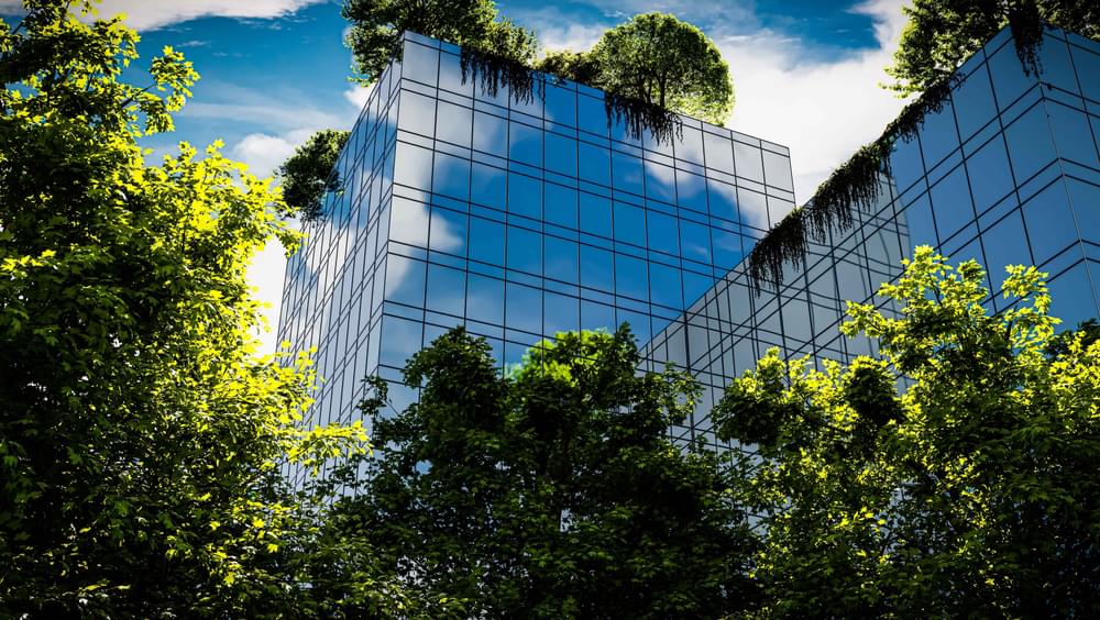 Green office building with glazing and trees