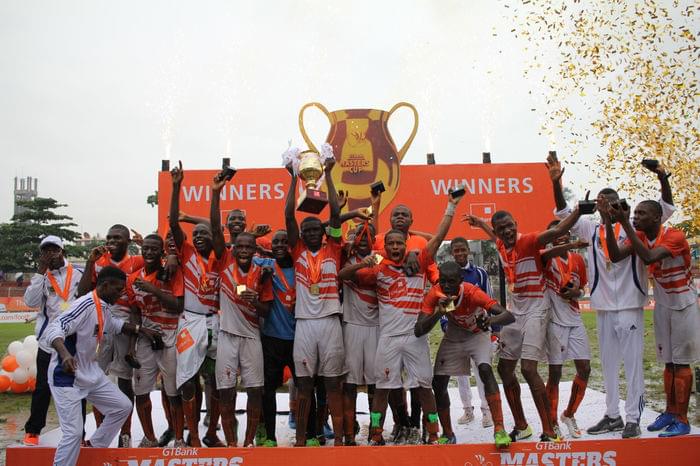 Captain of St Finbarrs College lifts the trophy with team mates af599ee76a60a3ffac0b778428c6ae2f