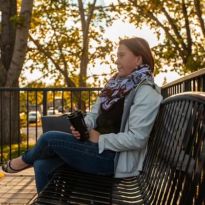 Lady sitting at Library Bench 1 (Adam)