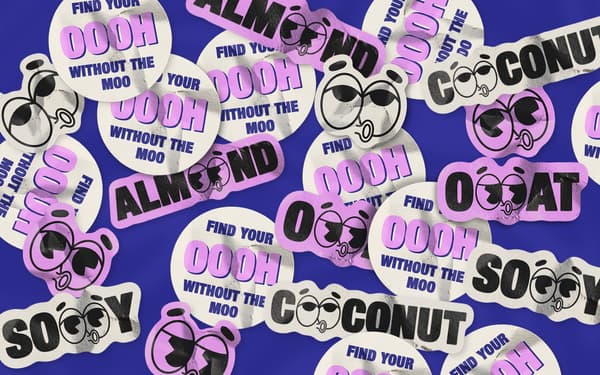A graphic with bold stickers reading 'soy', 'oat', 'almond', 'coconut', and 'find your oooh without the moo'.