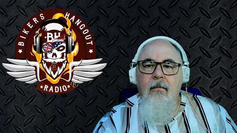 DJ Moto, a white man with a beard, sat down wearing headphones. The BIkers Hangout Radio logo is to the left of him.