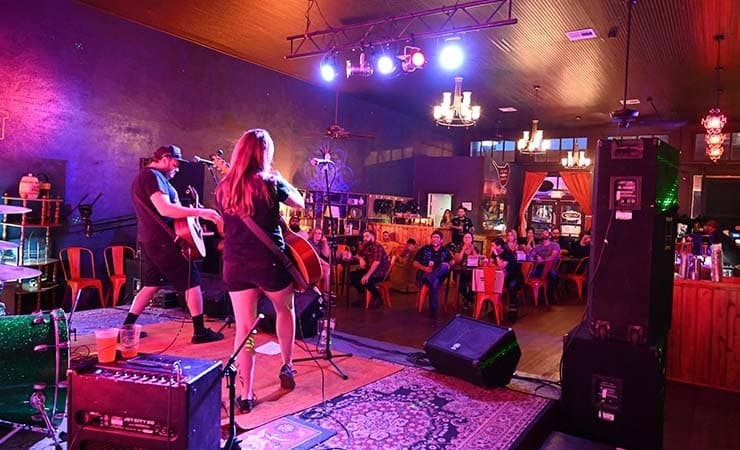 A band playing to the crowd at Black Sparrow Music Parlor