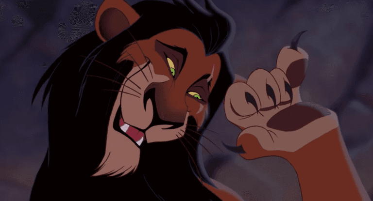 The animated lion character Scar from the Lion King outstretches a claw. He is a lion with a black mane and green eyes.