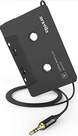A black cassette tape with an aux-in cable attached, set against a white background.