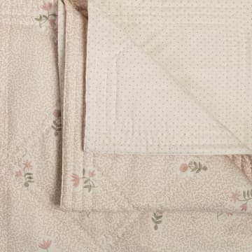 Wildflower in antique blue on printed squiggles bedcover in pale pink
