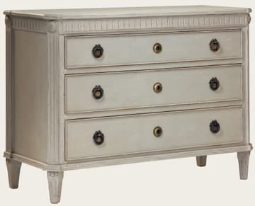 Commode with fluted carving