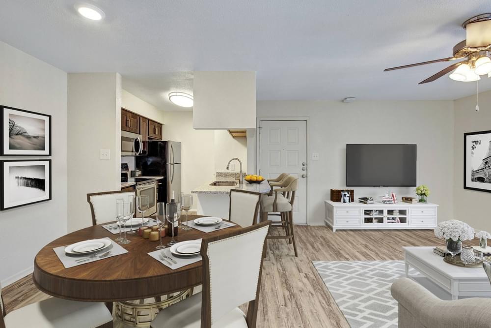 Village Green apartments Open floor layout with view of living, dining, and kitchen area.