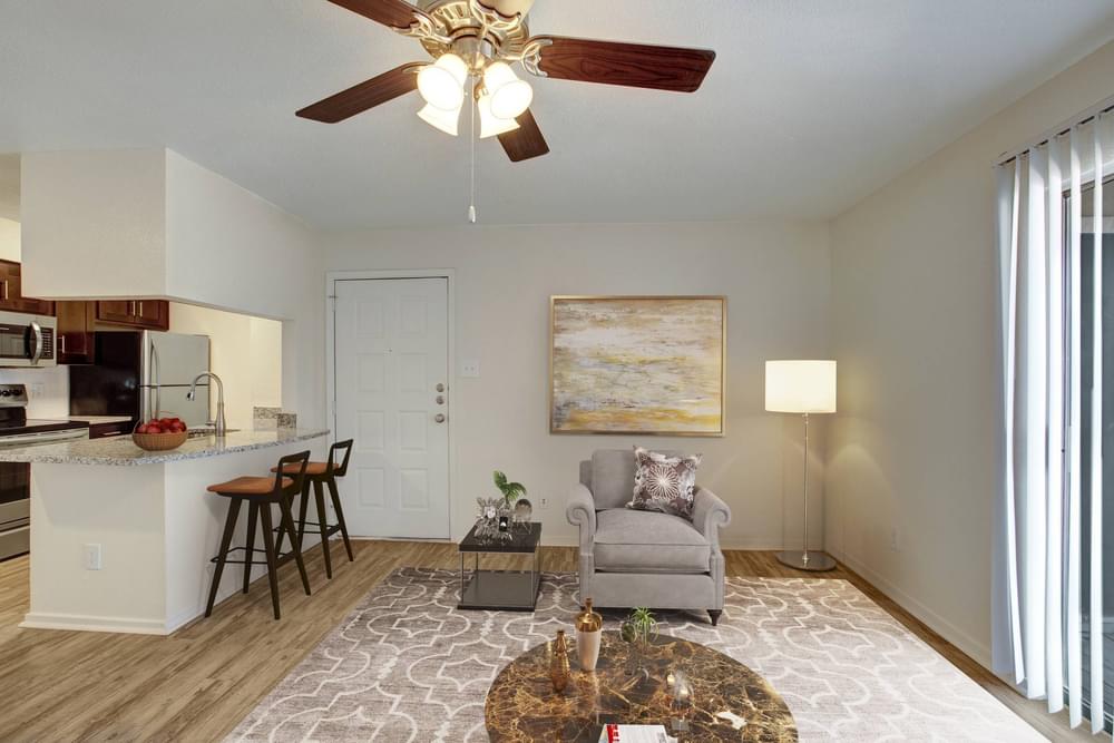Village Green apartments Open floor layout with view of living, dining, and kitchen area.