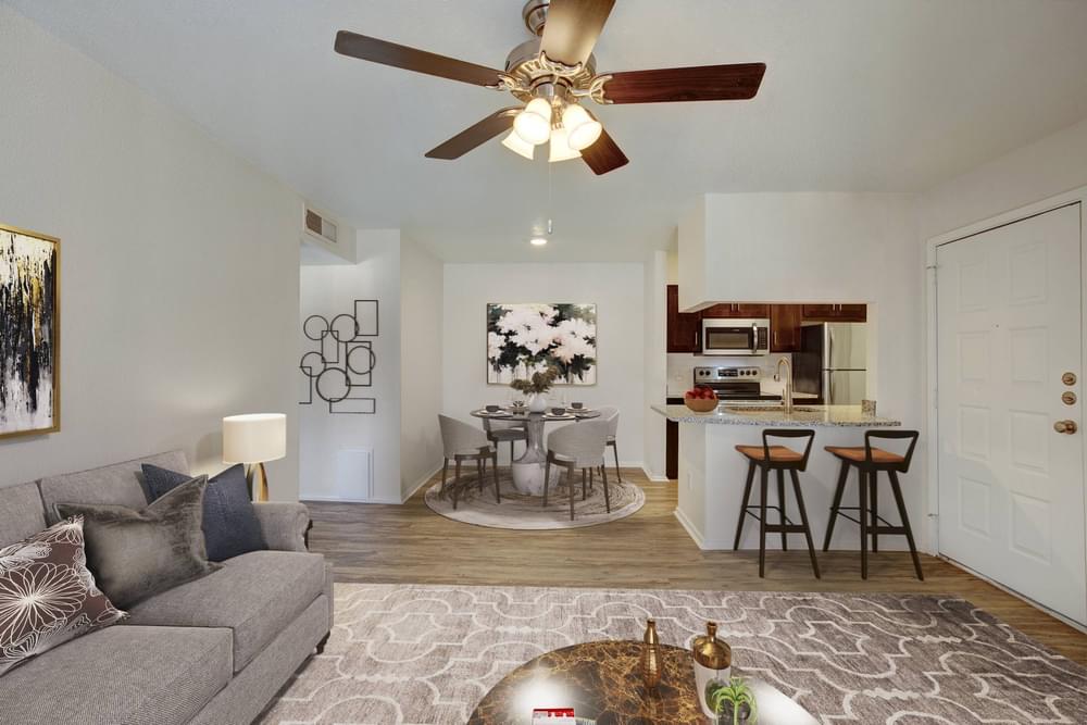 Village Green apartments Spacious living room with cozy sofas and coffee table.