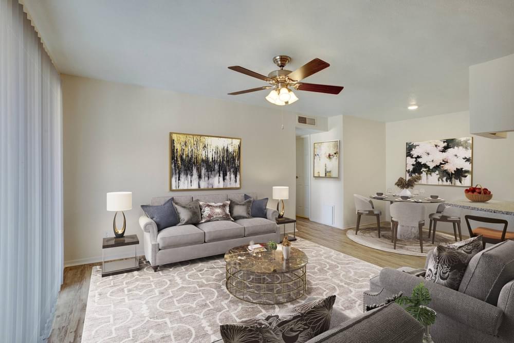 Village Green apartments Spacious living room with cozy sofas and coffee table.