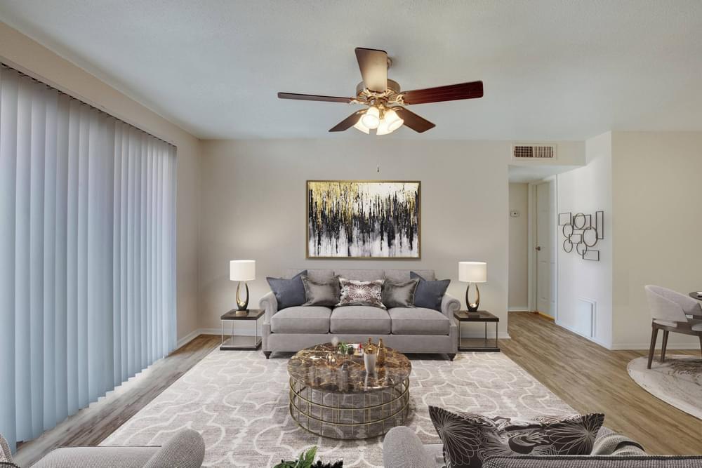 Village Green apartments Spacious living room with cozy sofas and coffee table.