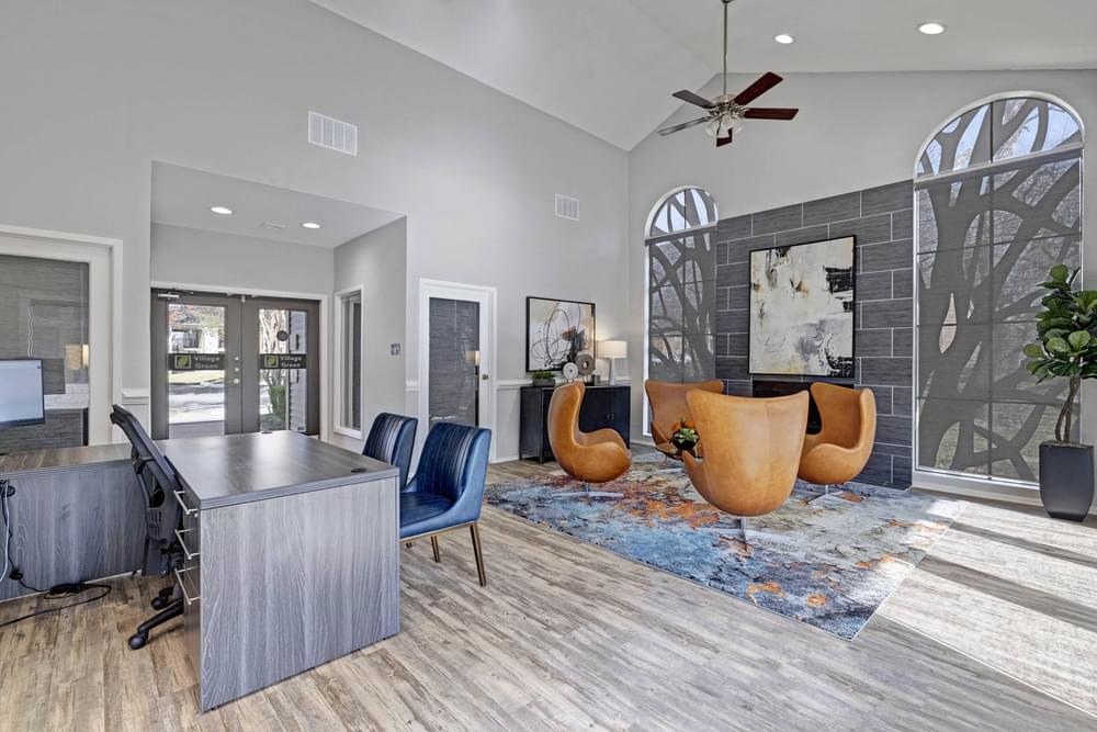 Village Green apartments Clubhouse lobby with staff welcome desks and lounge area.