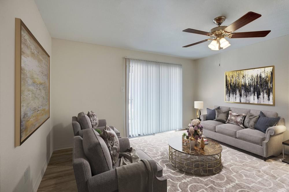 Village Green apartments Spacious living room with cozy sofas and coffee table.