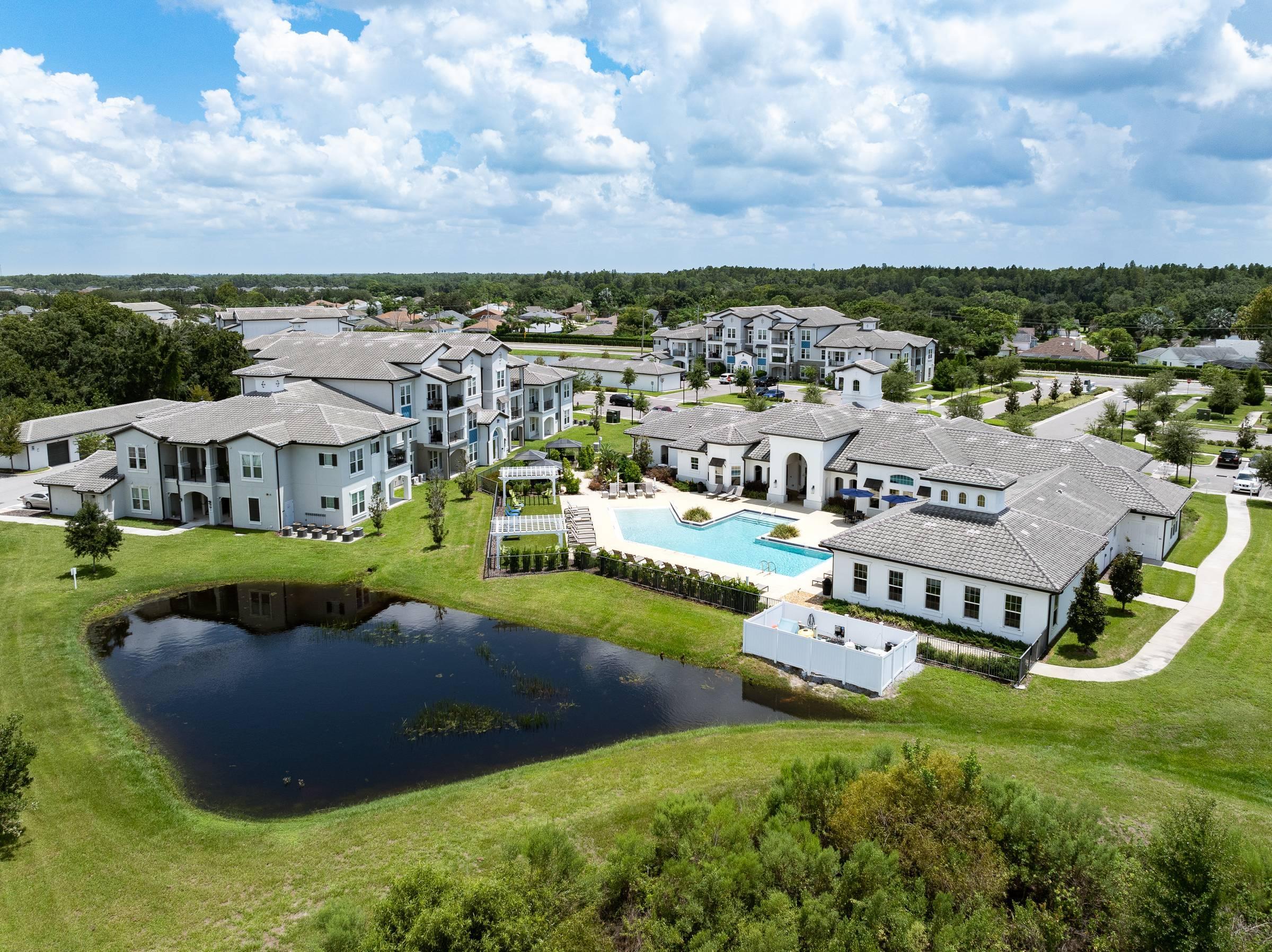 Shadetree Apartments aerial of community buildings & lagoon