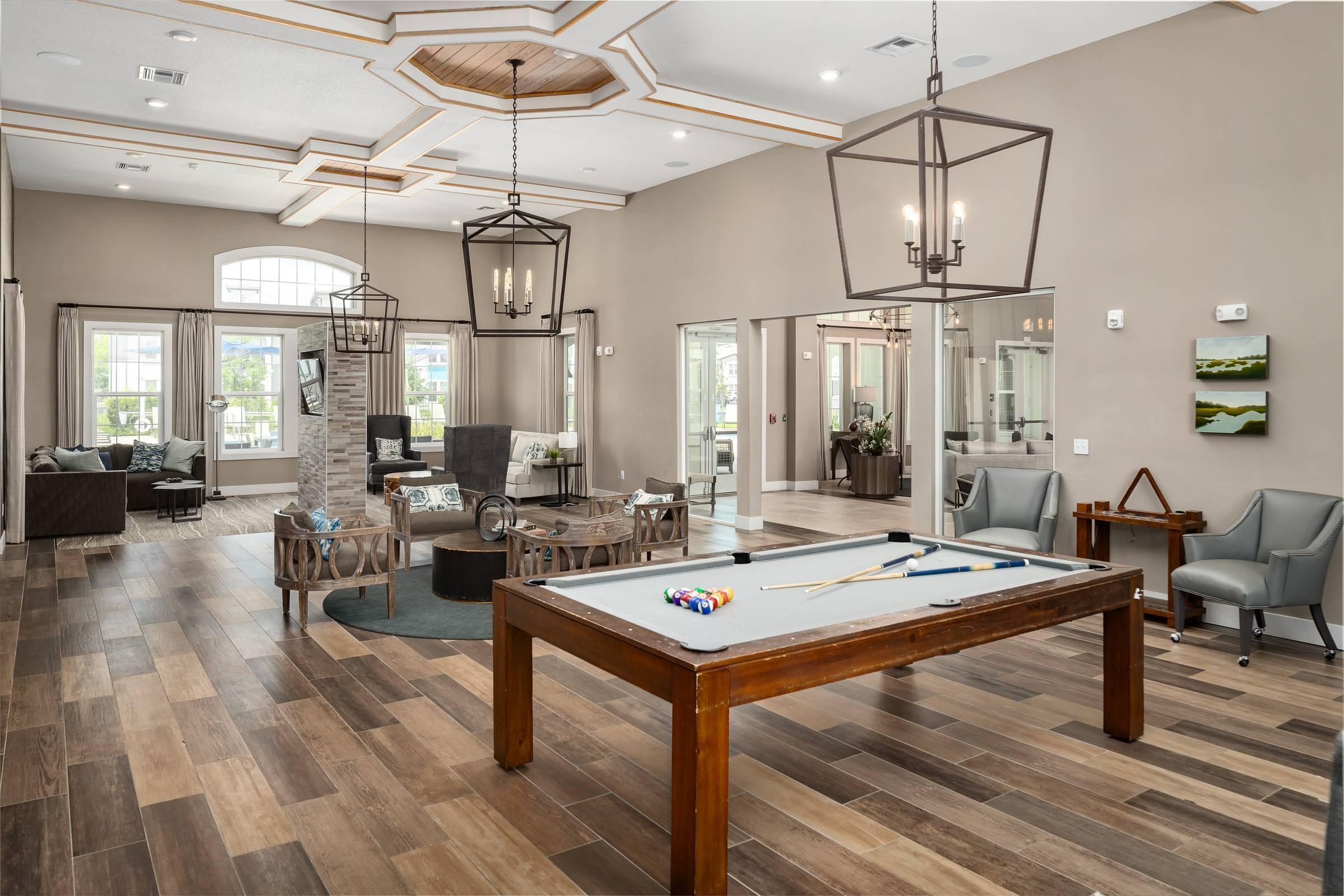 Shadetree Apartments clubhouse and lounge with beautiful and stylish furnishings, a billiards table abundant natural light