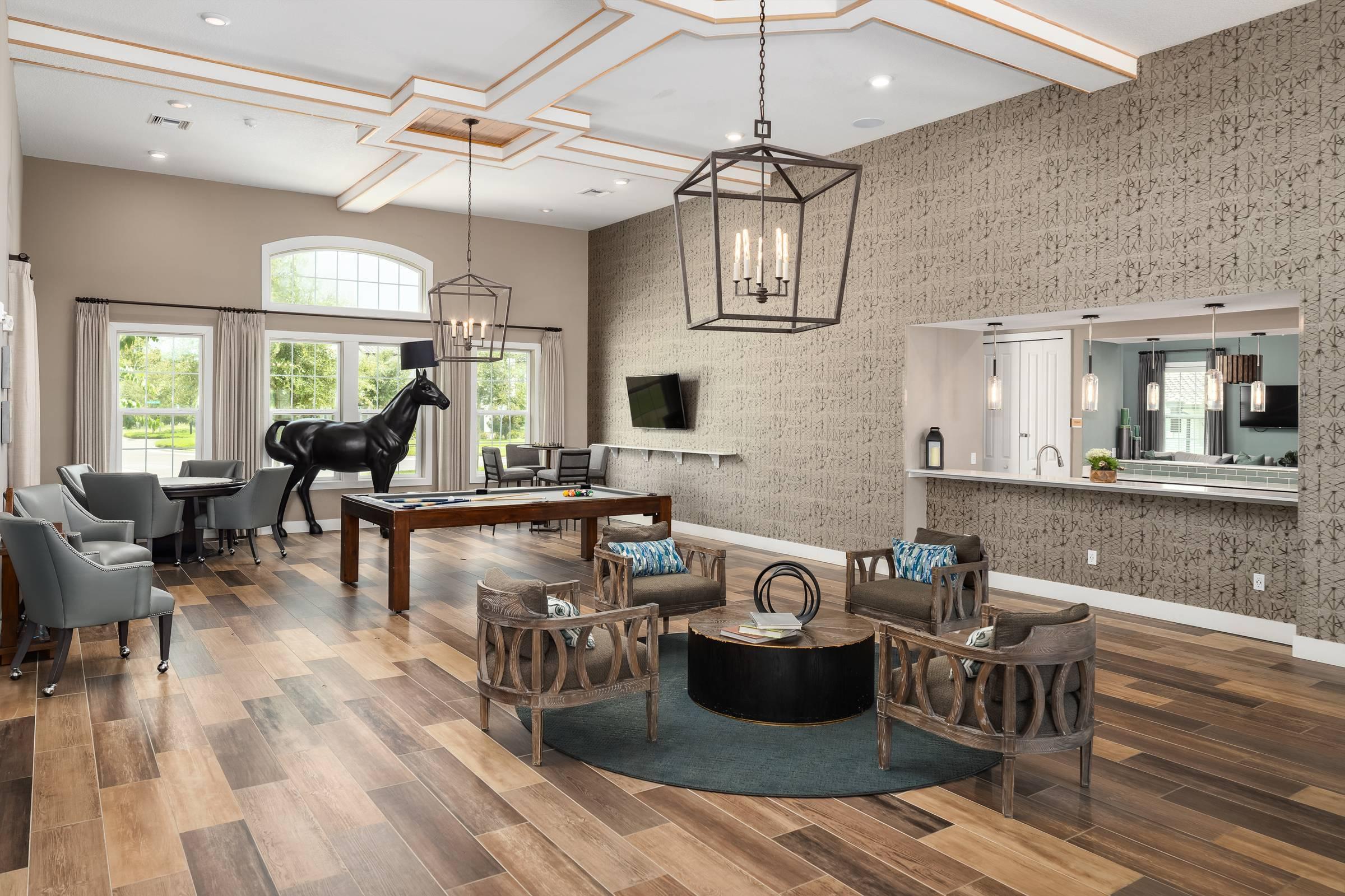 Shadetree Apartments clubhouse and lounge with beautiful and stylish furnishings, kitchen station, and abundant natural light