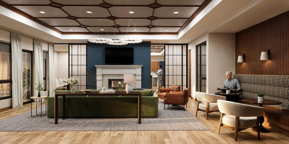 The Ensley with a beautifully-designed club room with a sofa, coffee table, and abundant natural light