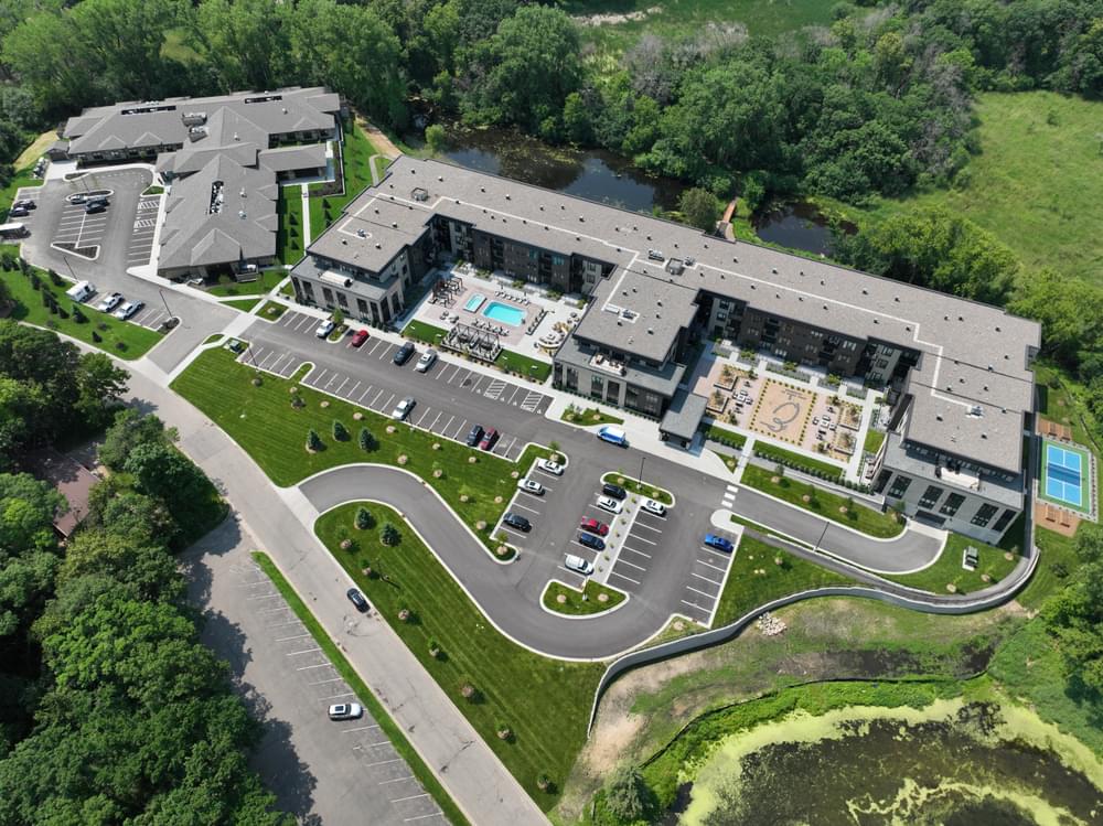 Aerial of The Ensley exterior with Minnesota- and Minnetonka-inspired design and natural surroundings