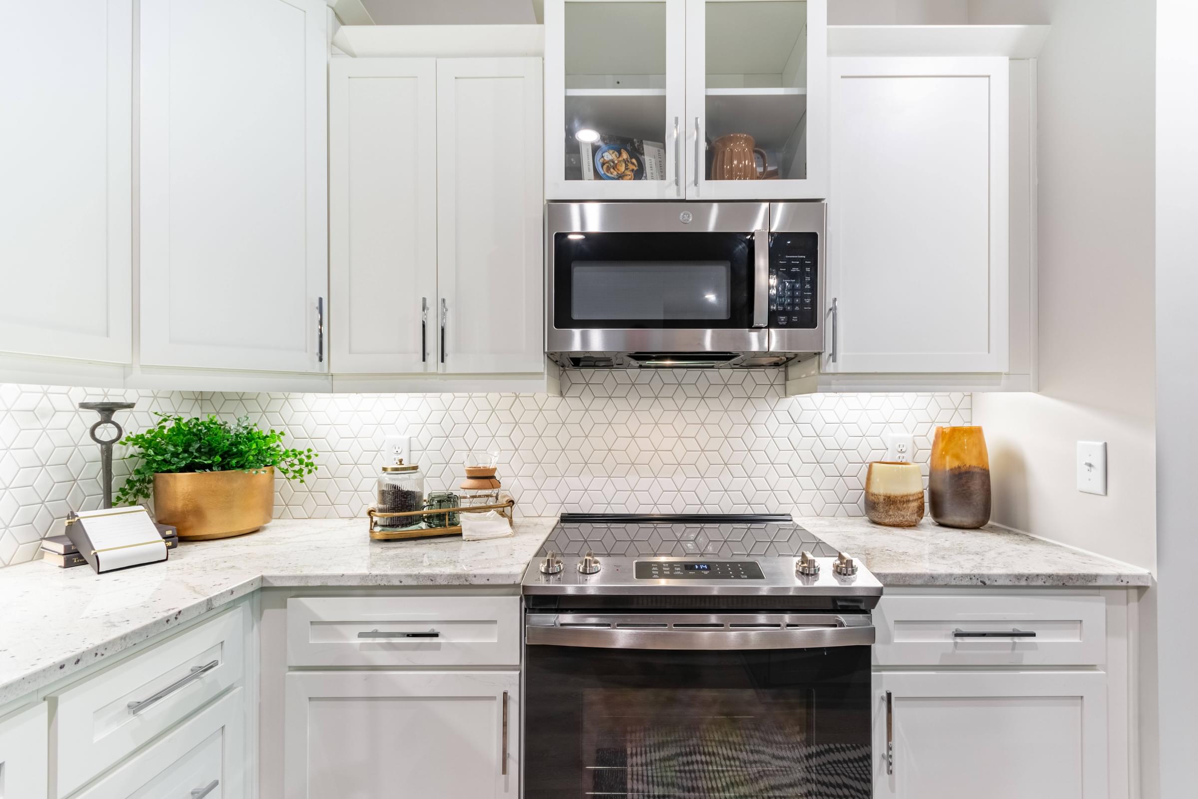 Modern Kitchens with Stand-Alone Islands, Designer Tile Backsplash, Granite Countertops, Stainless Steel Appliances, and Smooth Ceramic Cooktops*