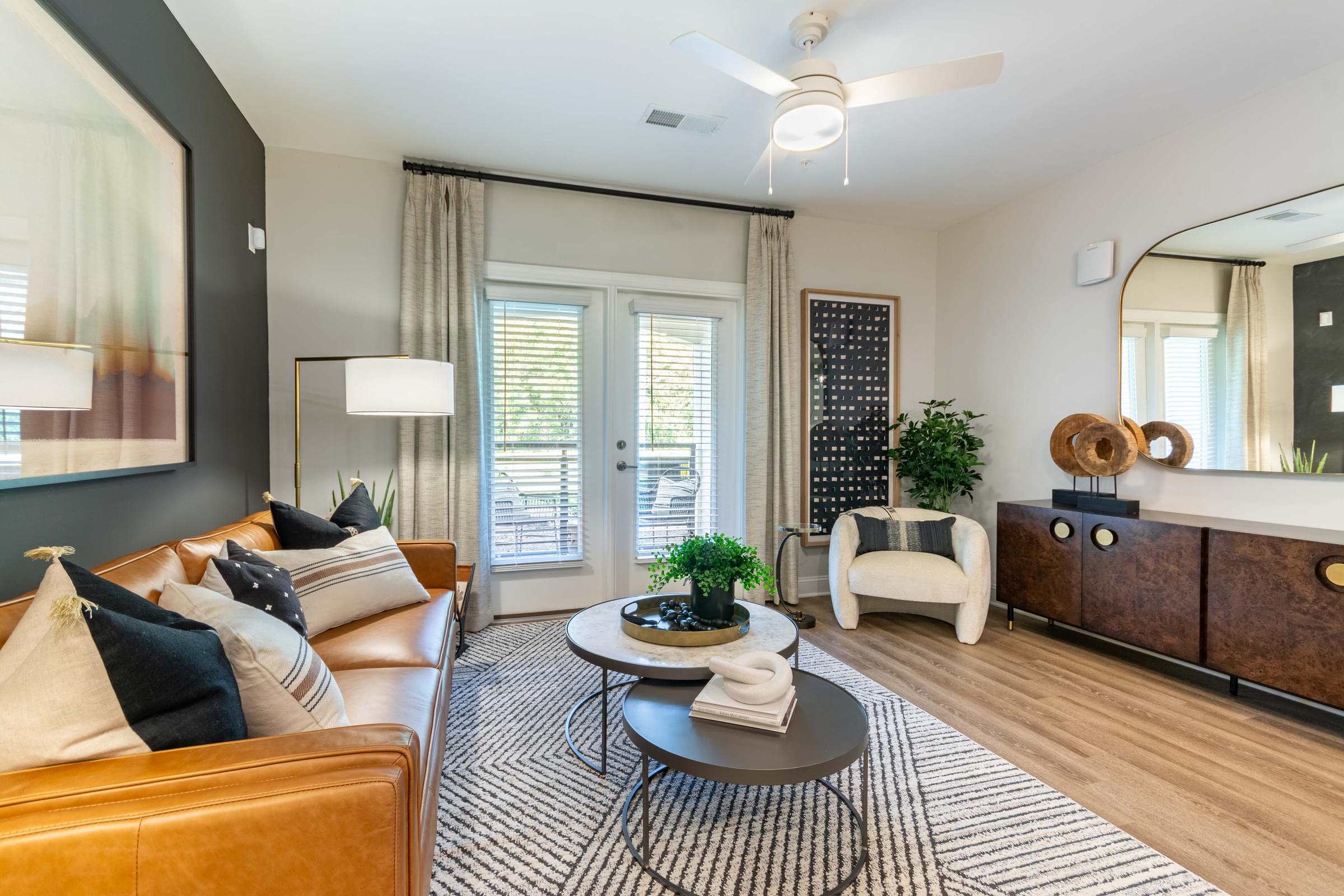 Open Living Room with Modern Features that leads to a Patio