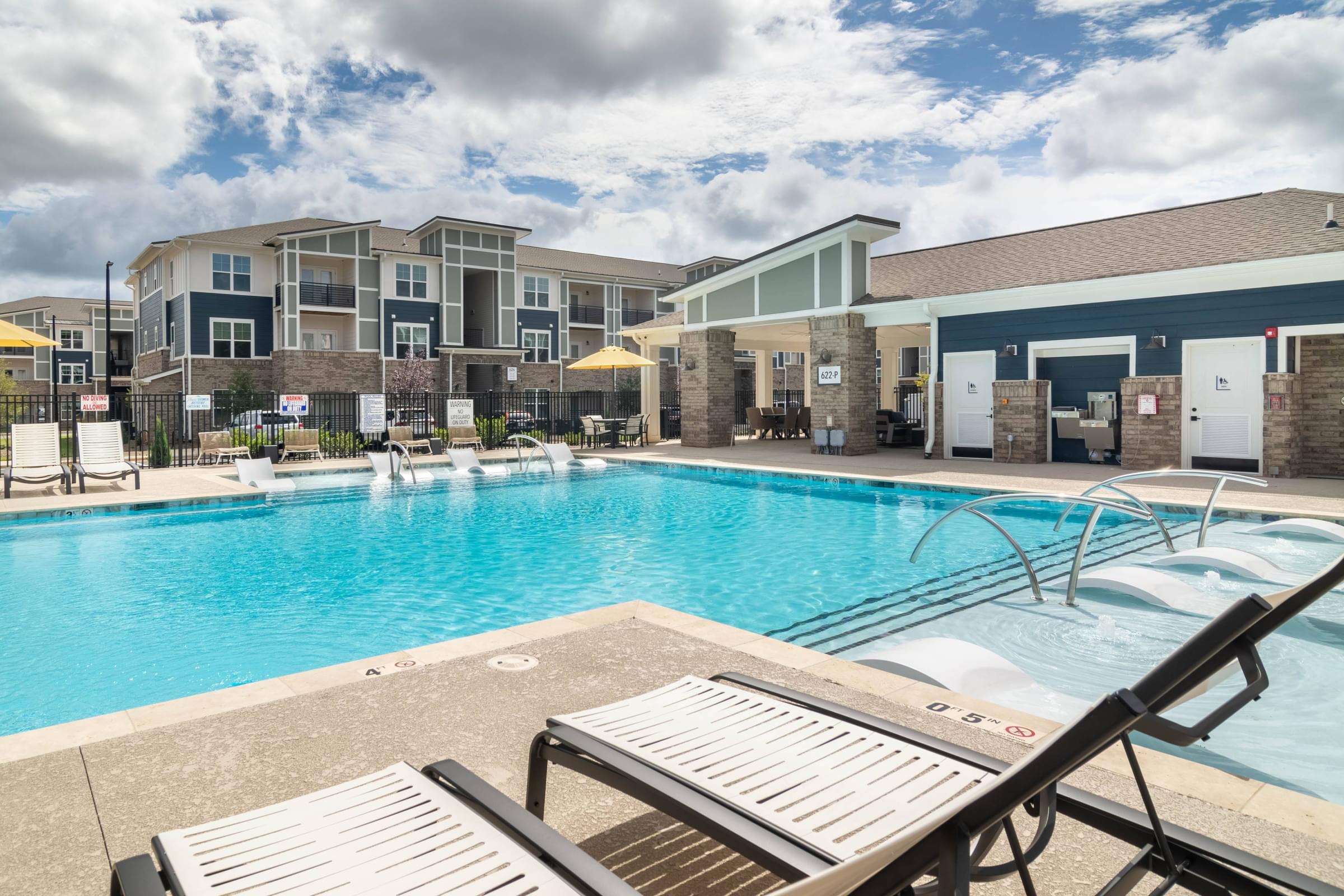 our apartments offer a swimming pool with chairs and umbrellas