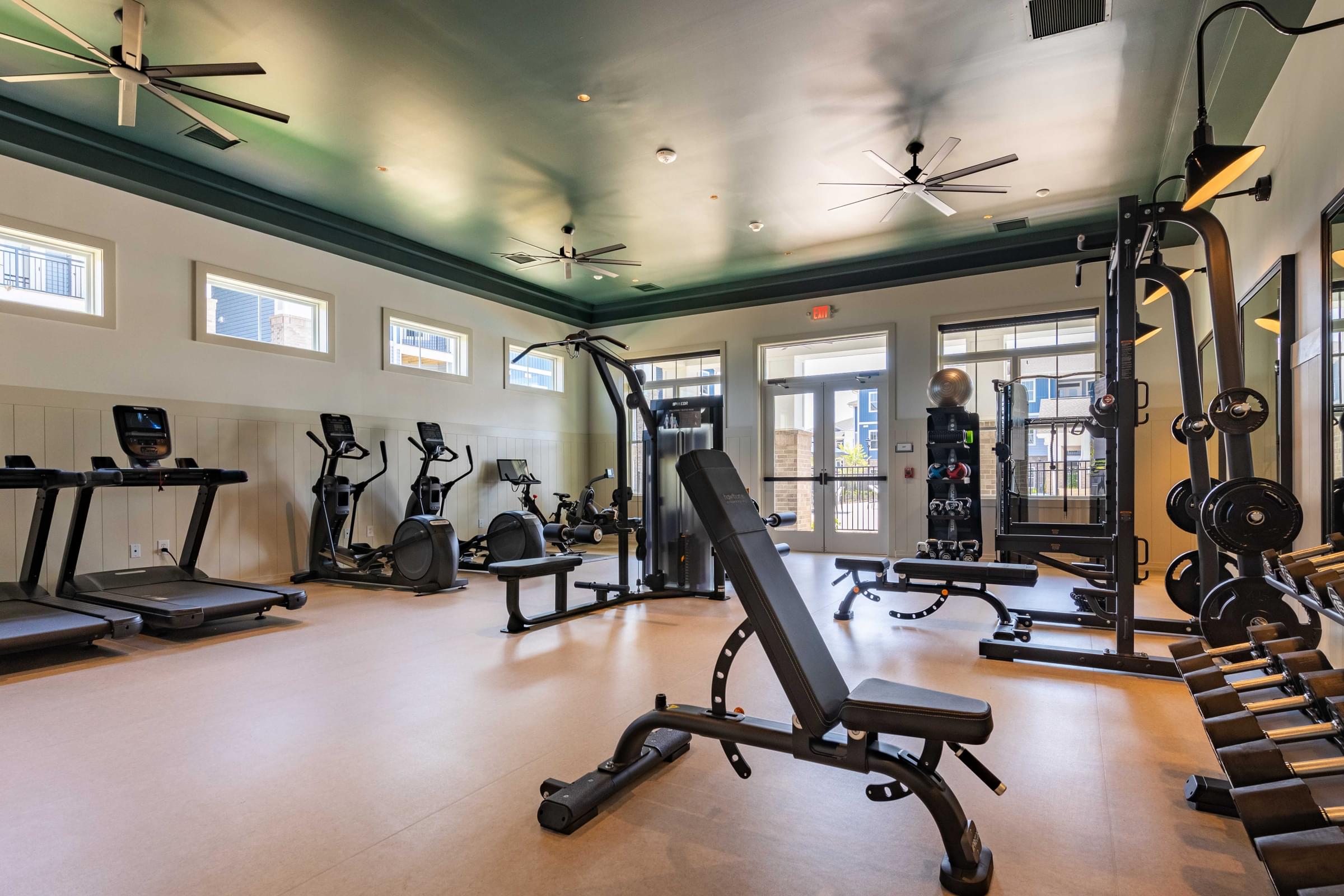 24-Hour Expansive Fitness Center with Free Weights and Cardio Equipment