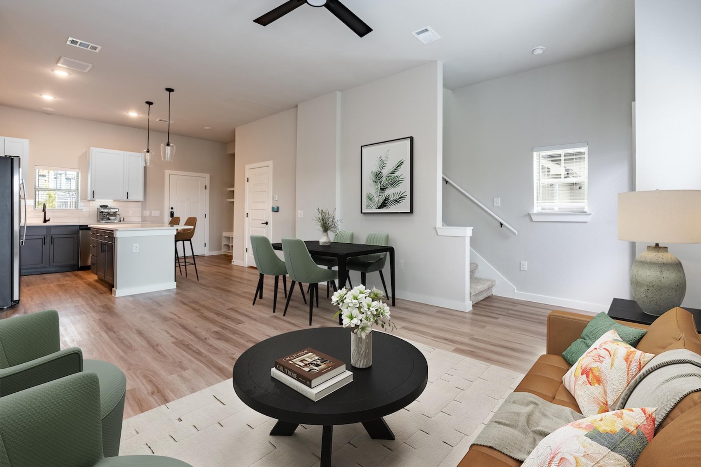 San Antonio 2 Bedroom Townhome A living room with a black coffee table and a green chair.