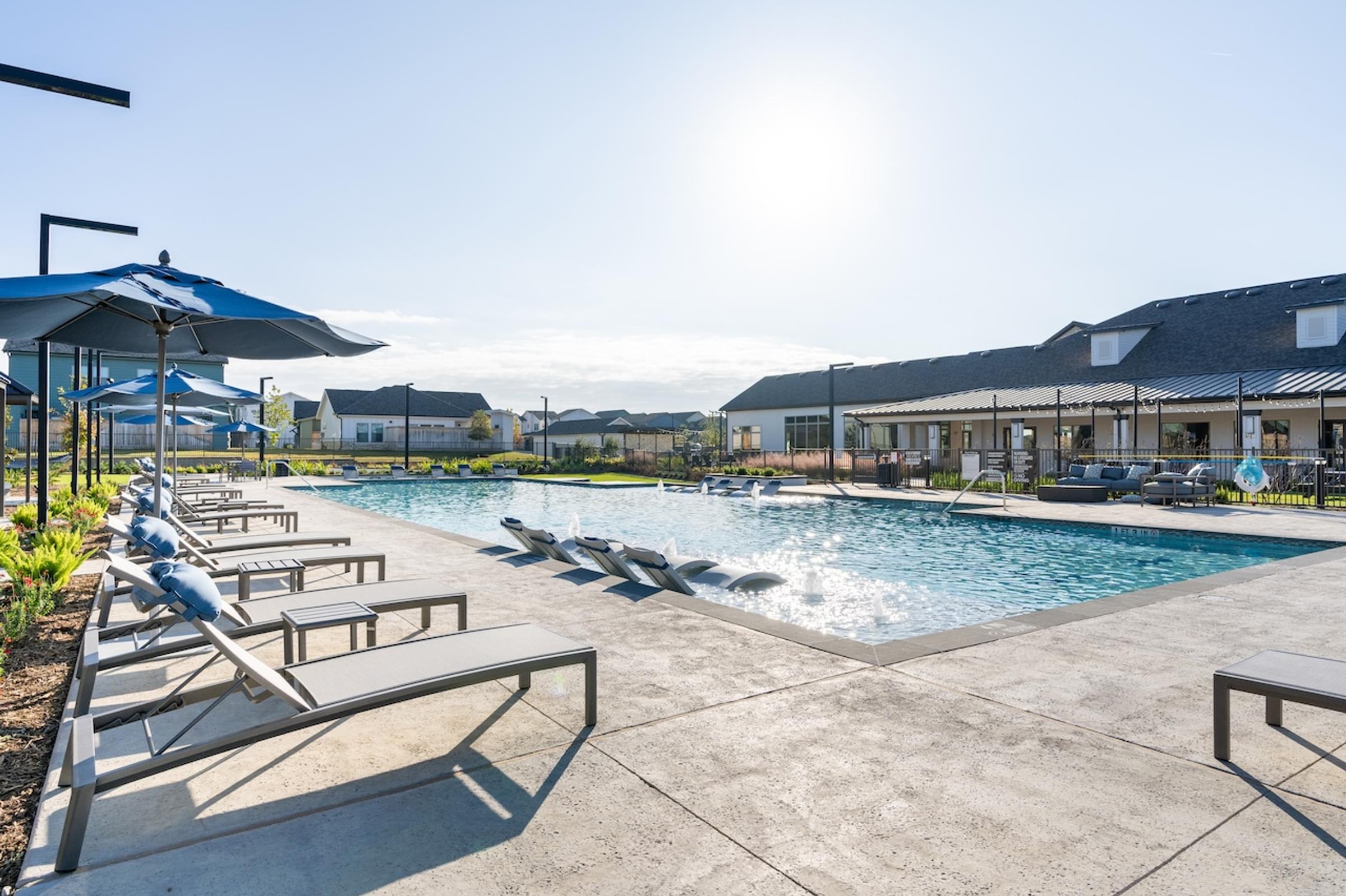 A sunny day at the pool with sun shining brightly.
