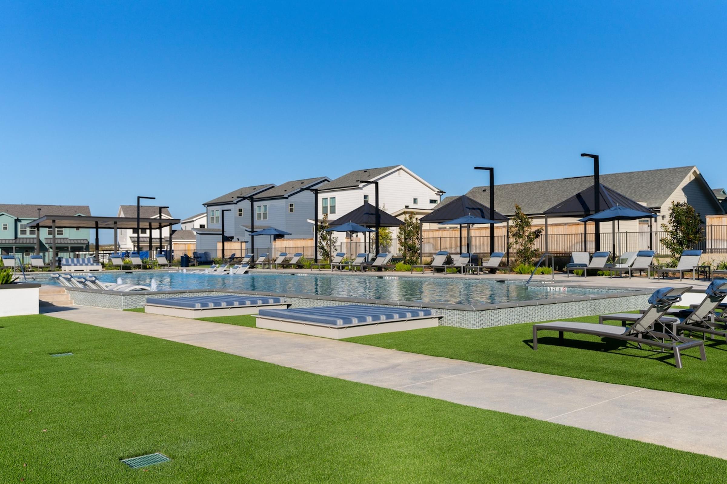 A residential area with houses and a pool.