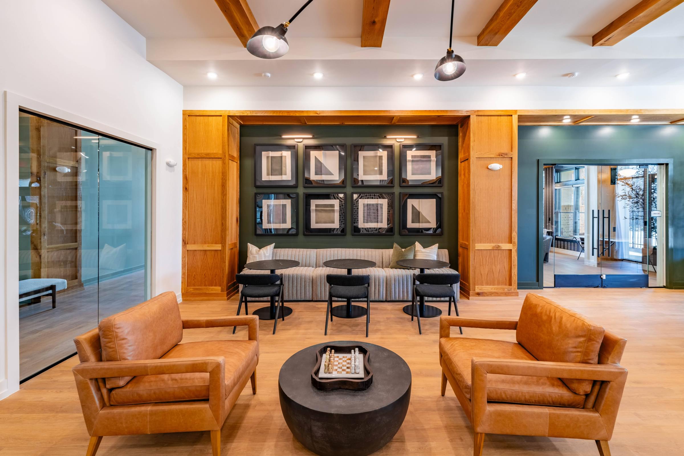 A living room with a brown leather chair and a black coffee table.