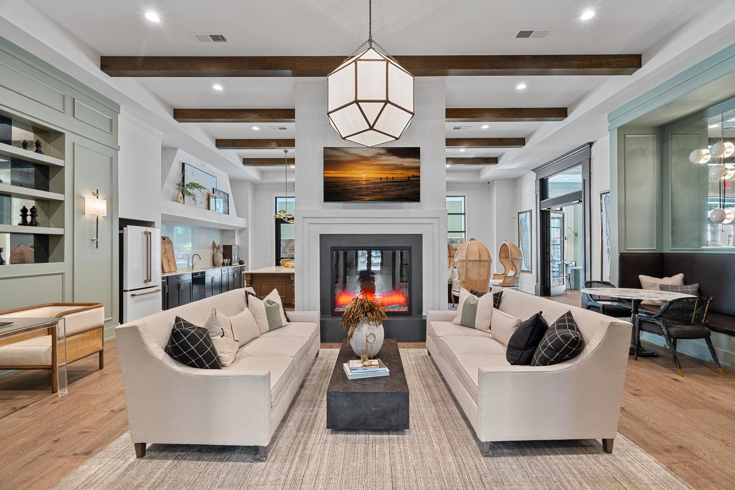 A modern living room with a fireplace and two couches for seating.