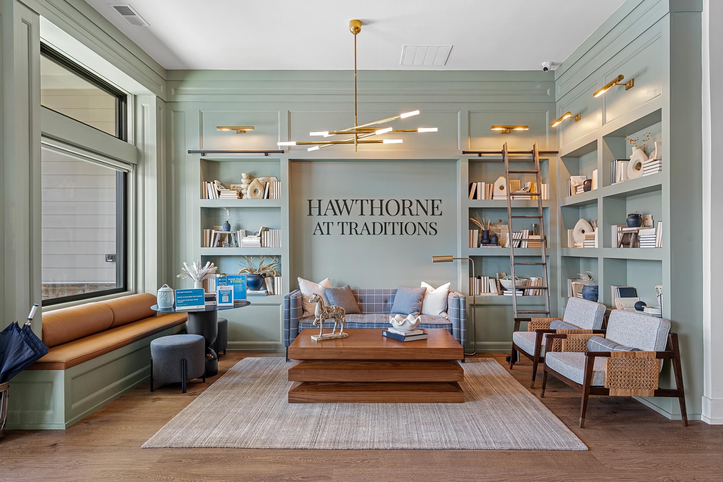 Clubhouse entrance with Hawthorne Traditions sign and seating area.