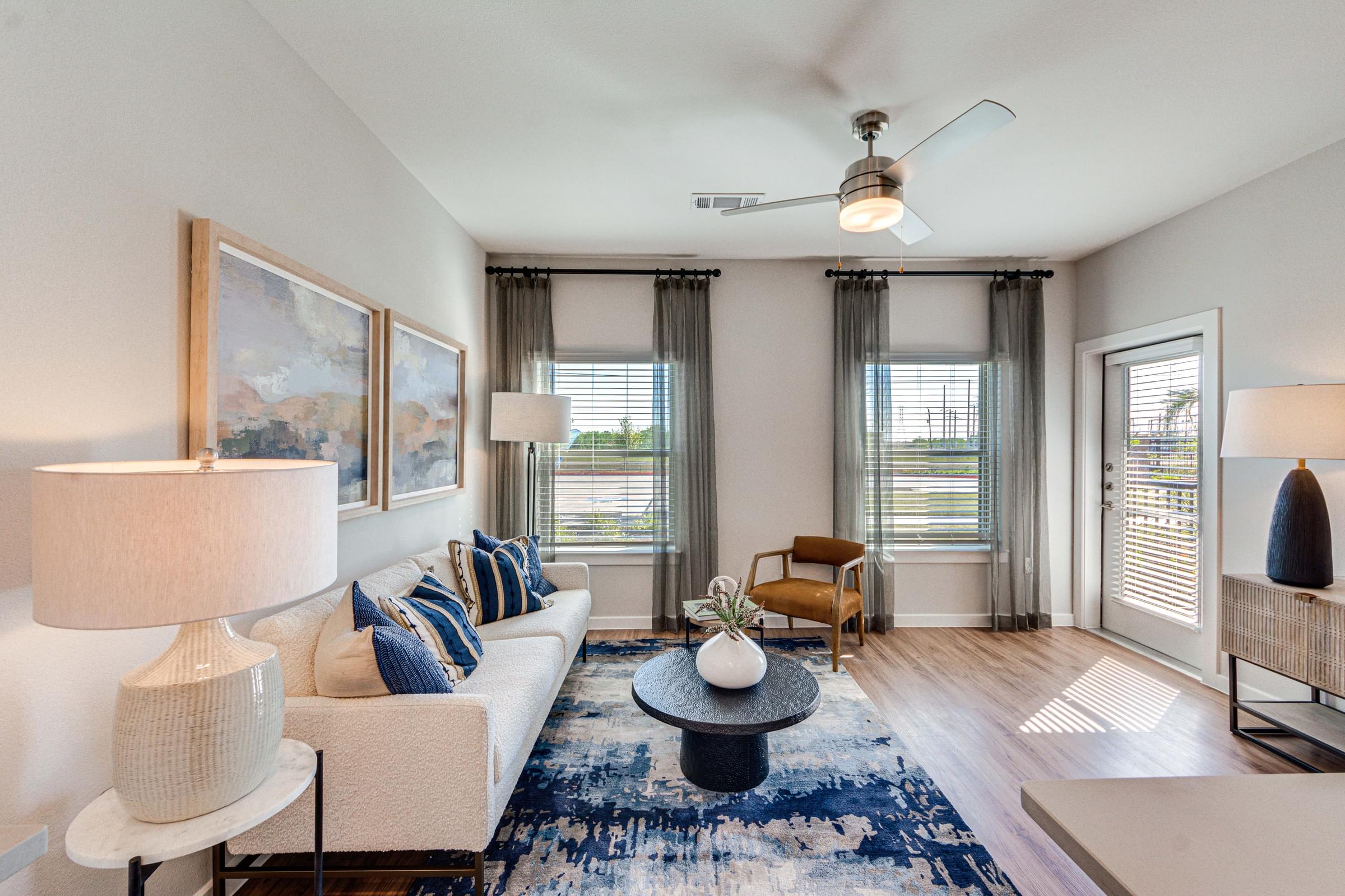 the living room of an apartment with a couch and a table