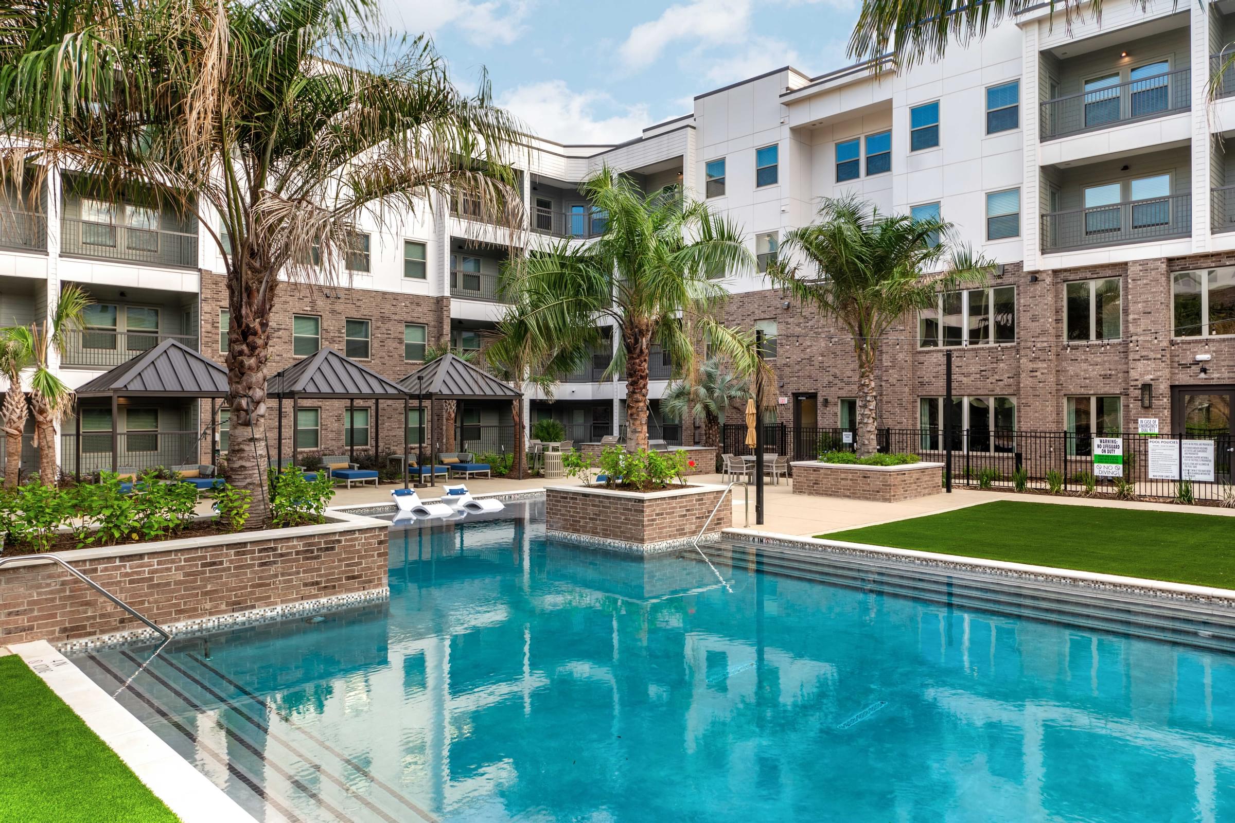 Custom Resort-Style Swimming Pool with Sun Shelf and Inset Seating