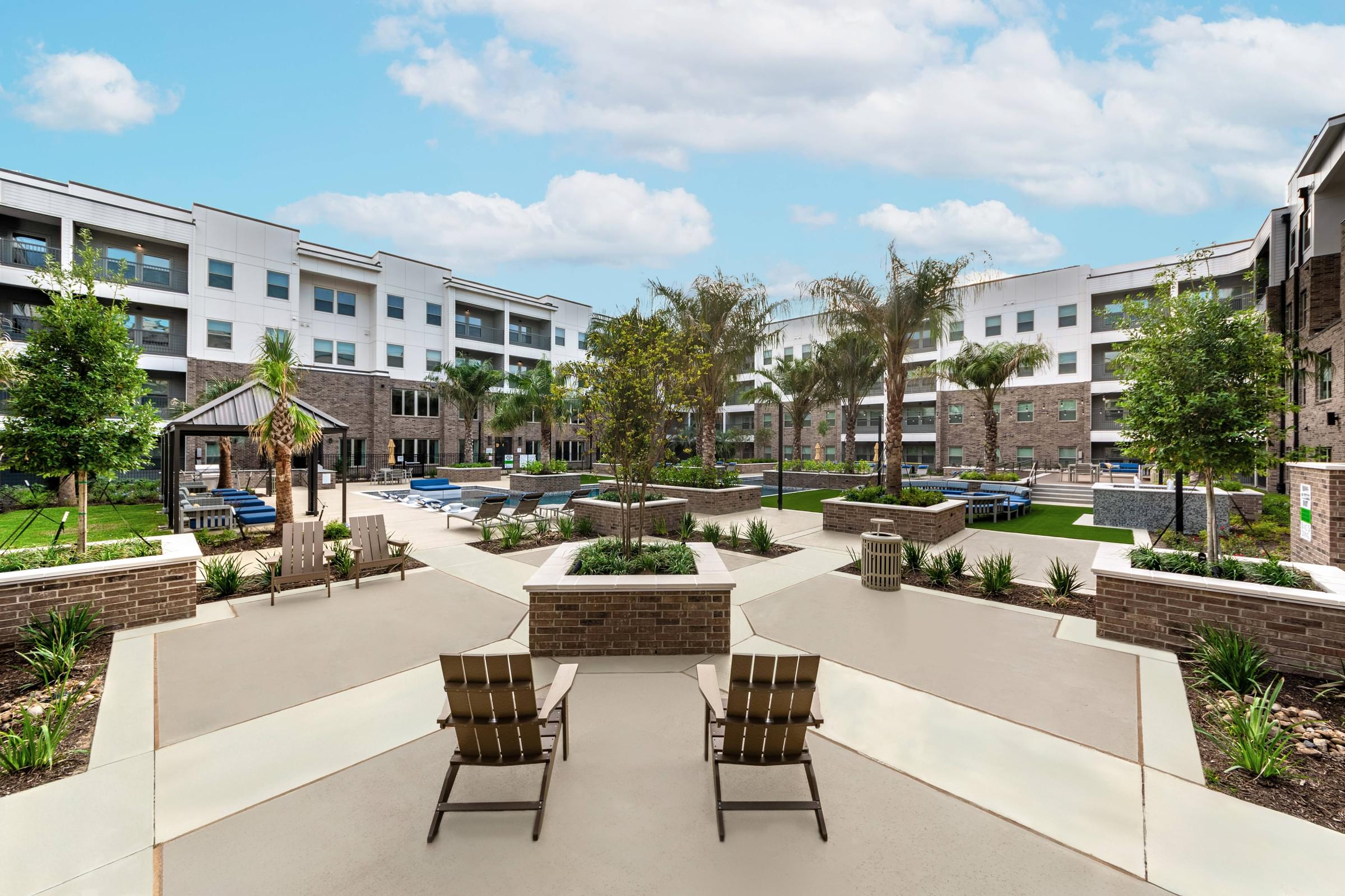 Courtyard with Lounge Seating that Looks Into the Gorgeous Resort-Style Pool