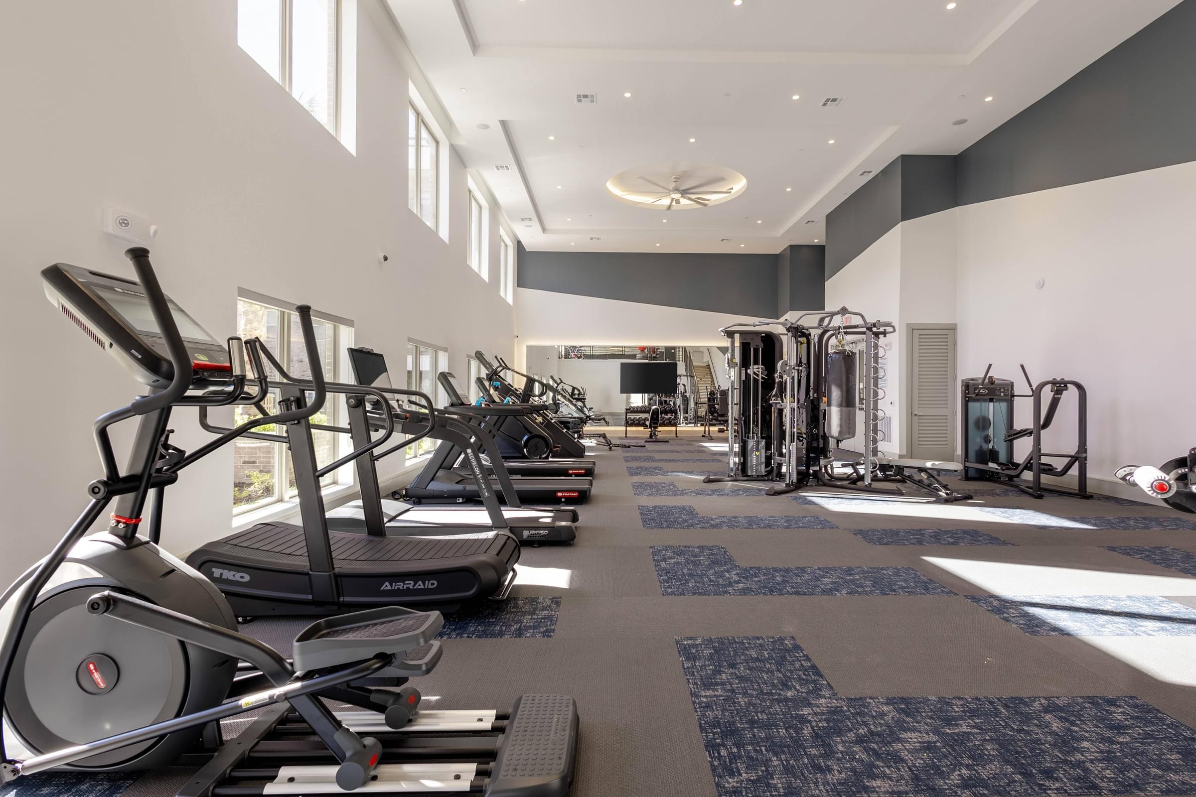 24-Hour Expansive Two-Level Fitness Center with Echelon Fitness Training Mirror