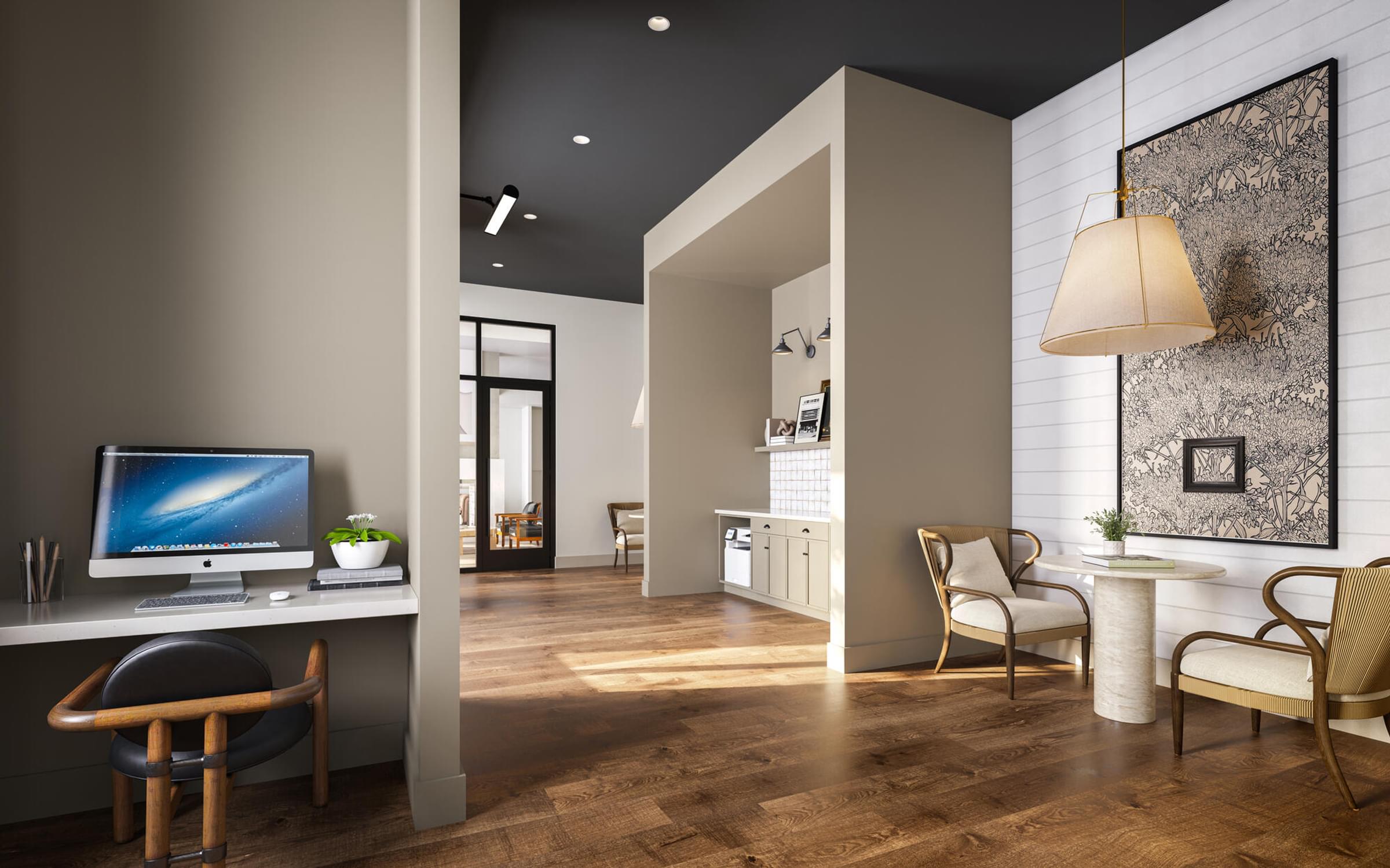 A modern home office with a wooden desk and chairs.