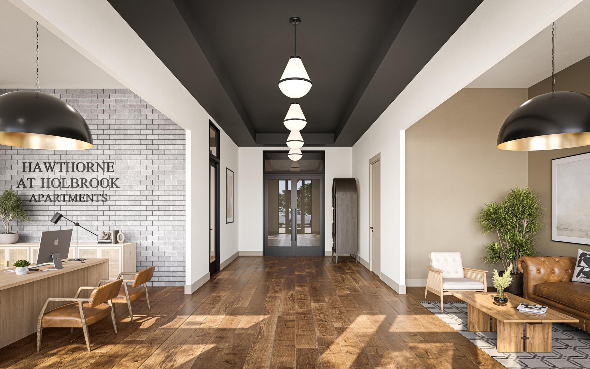 A modern office lobby with wooden floors and a white brick wall.