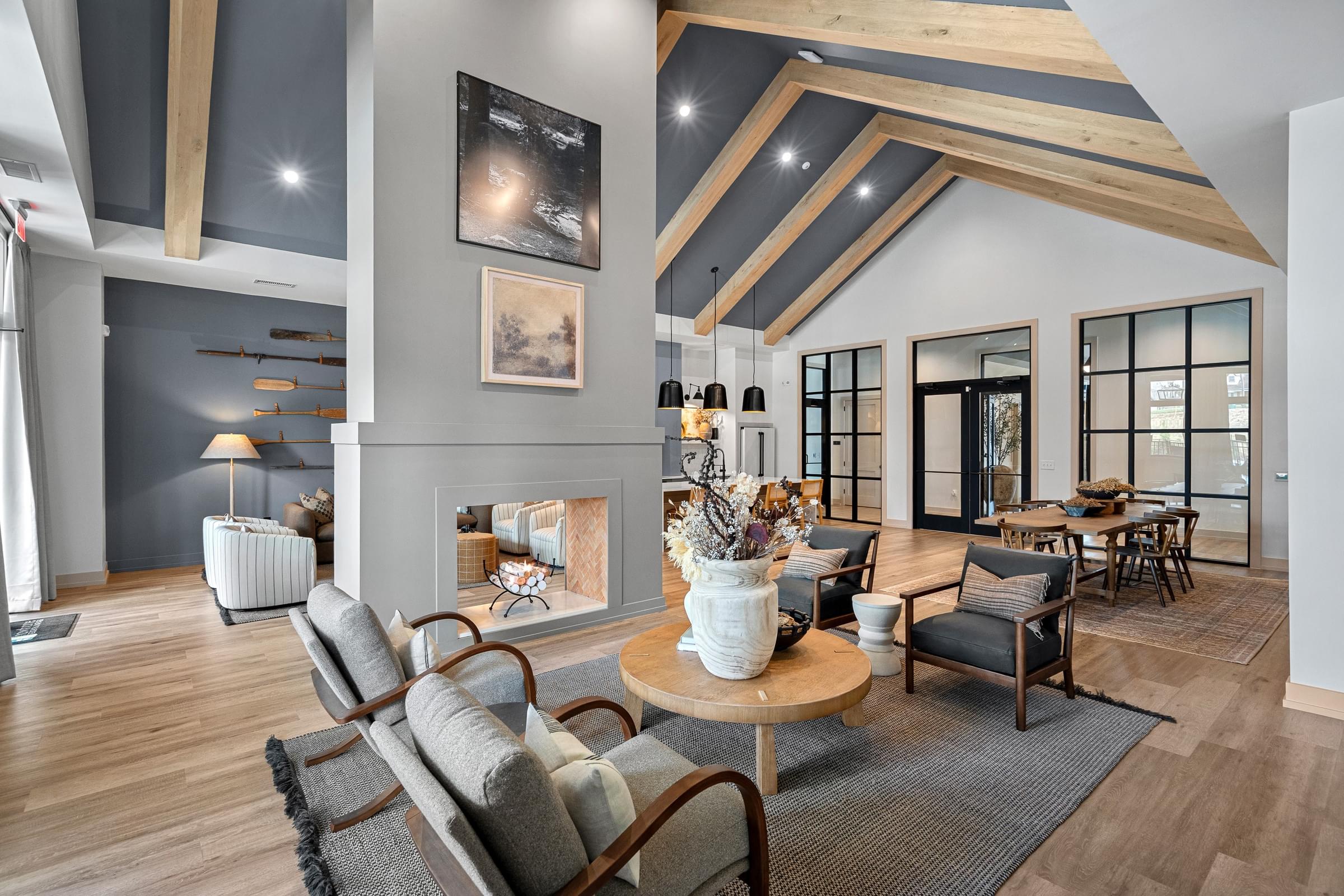 A modern living room with a wooden floor and a large window.