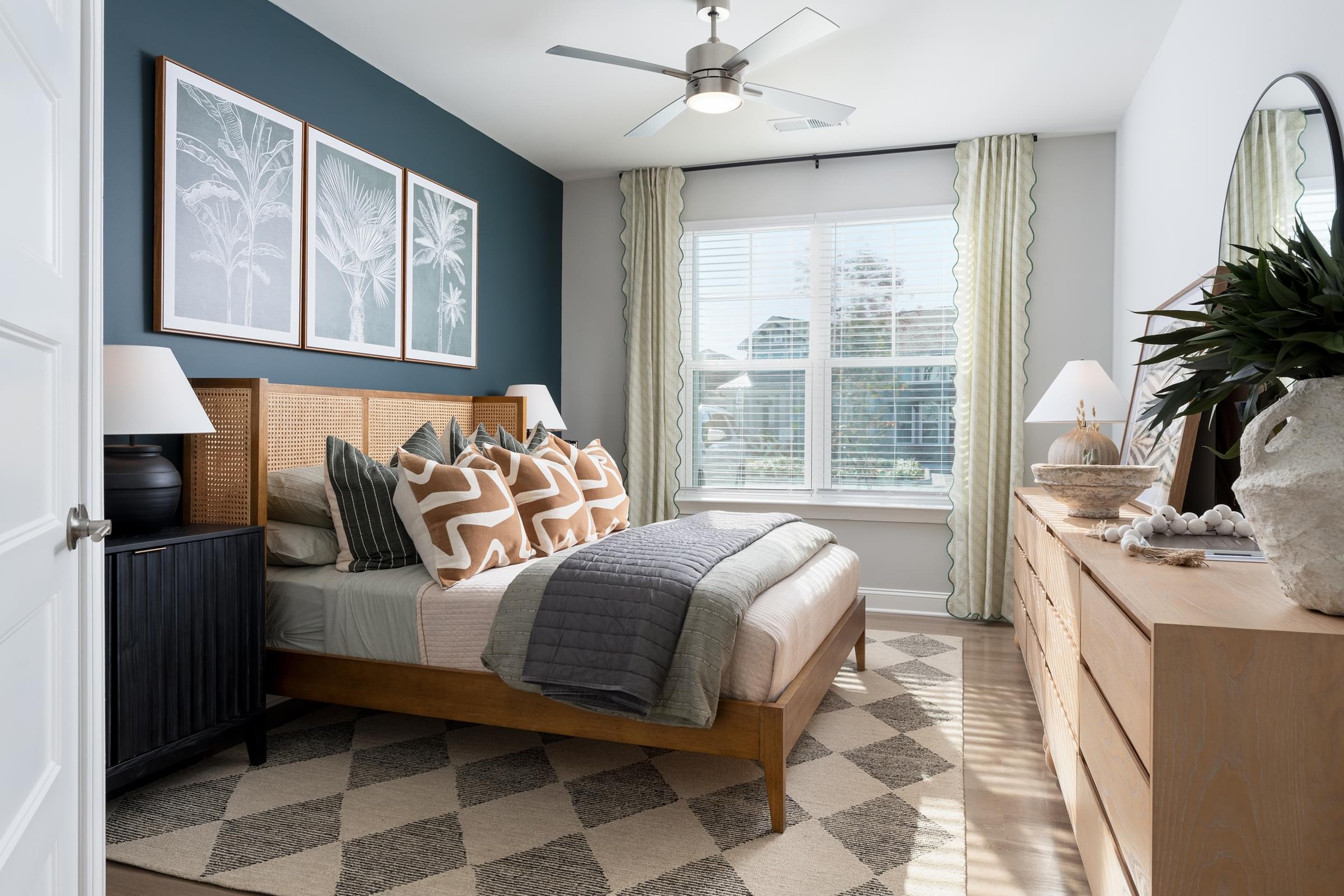 Bedrooms With Large Windows, 2-Inch Faux Wood Blinds, and Ceiling Fans
