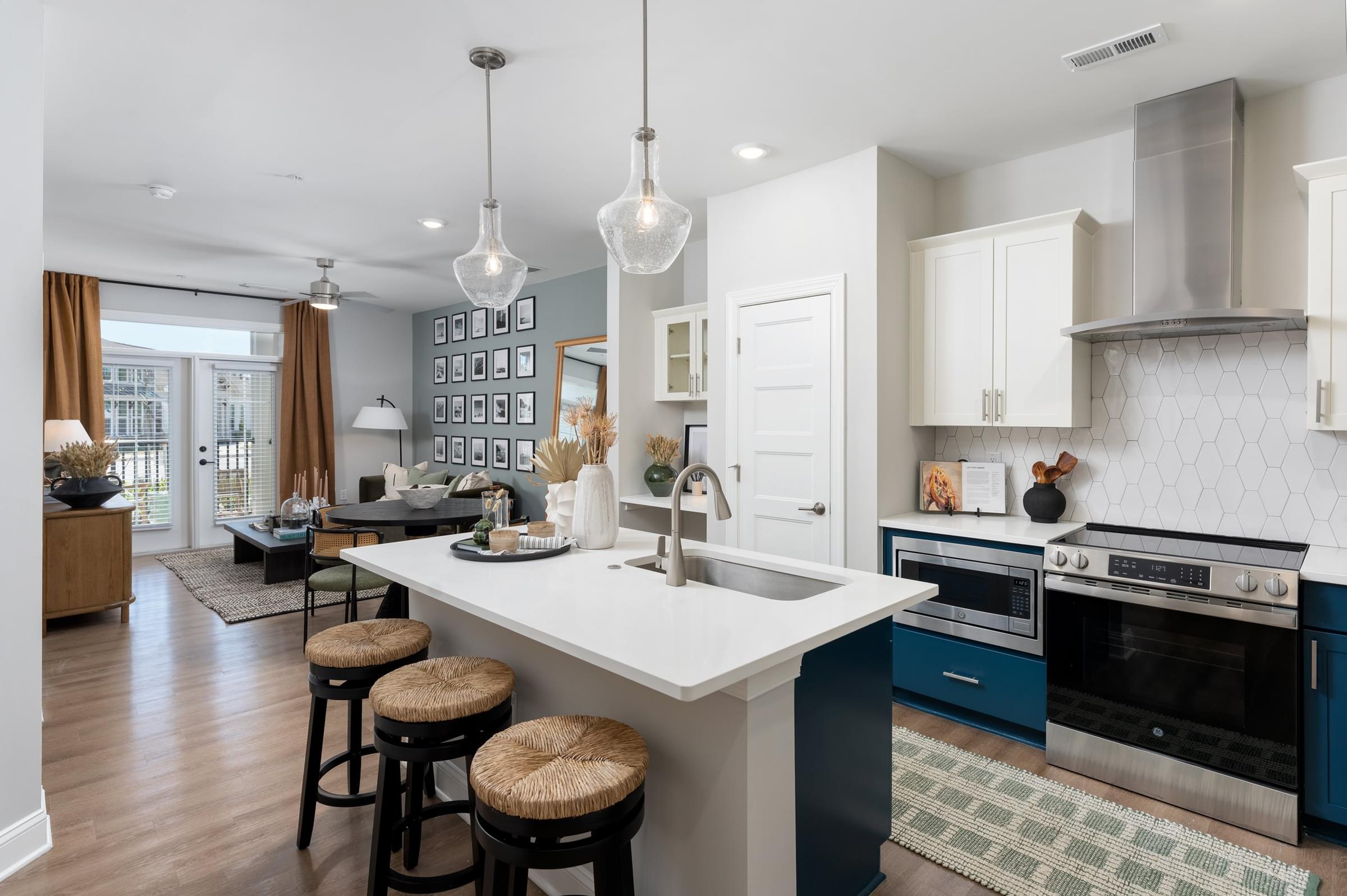 Modern kitchen with an open layour that peeks into the living room
