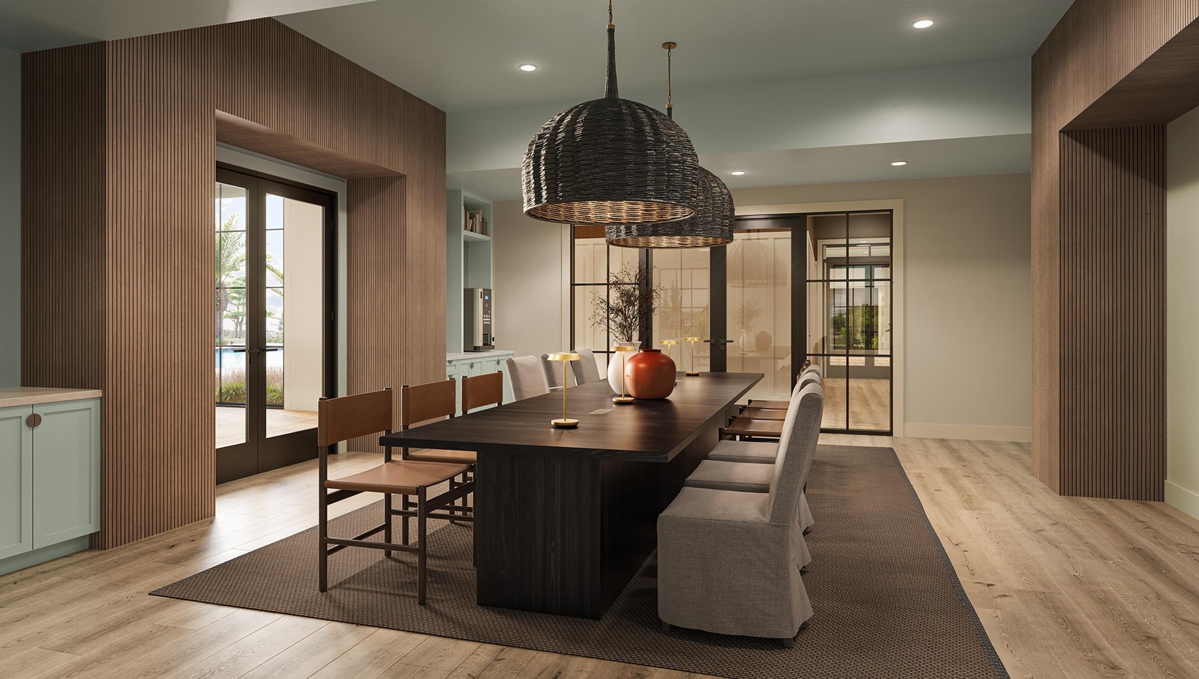 A modern dining room with a dark wood table and chairs.