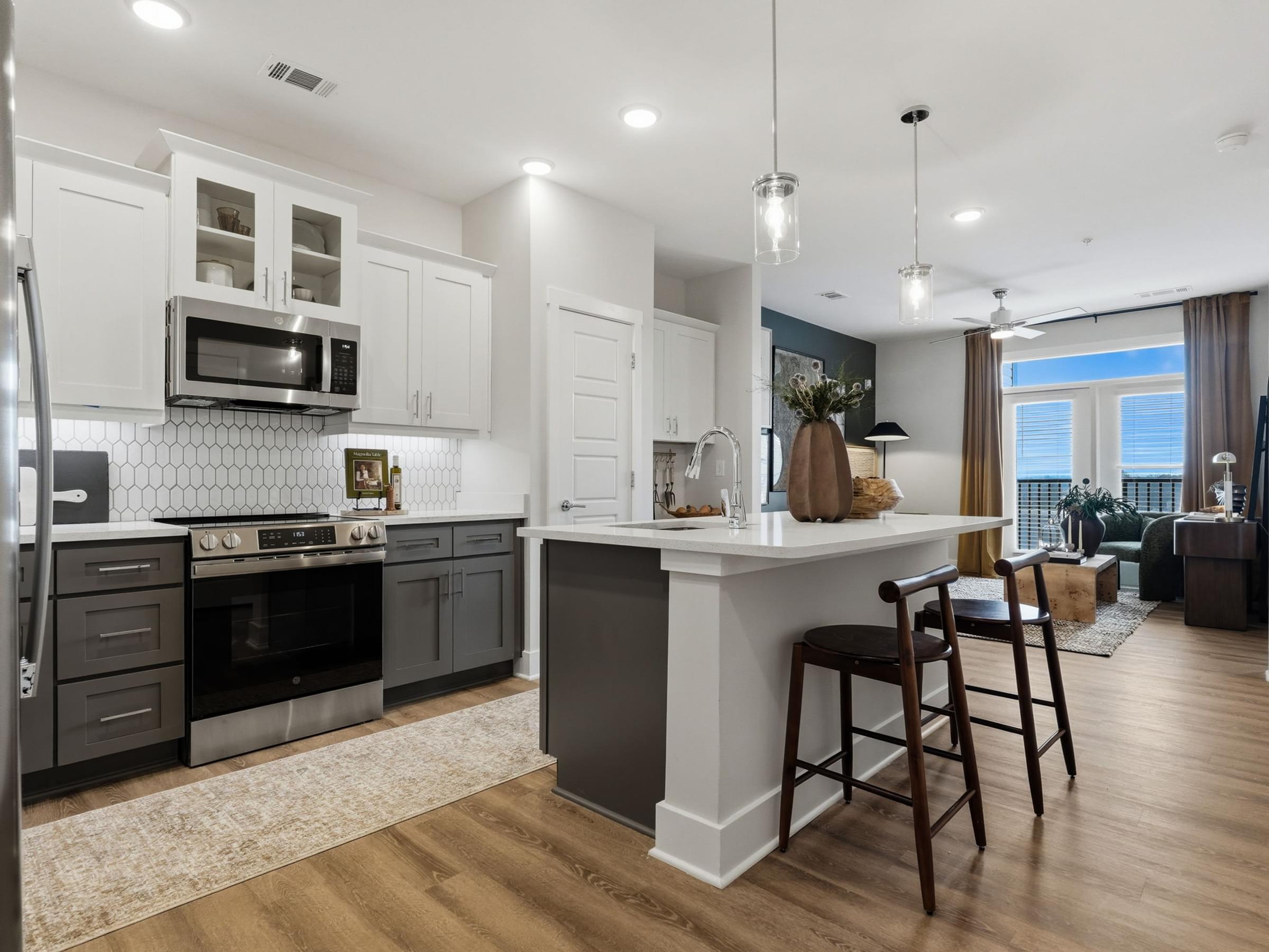 Modern Kitchens with Stand-Alone Islands, Designer Tile Backsplash, and Granite Countertops Throughout