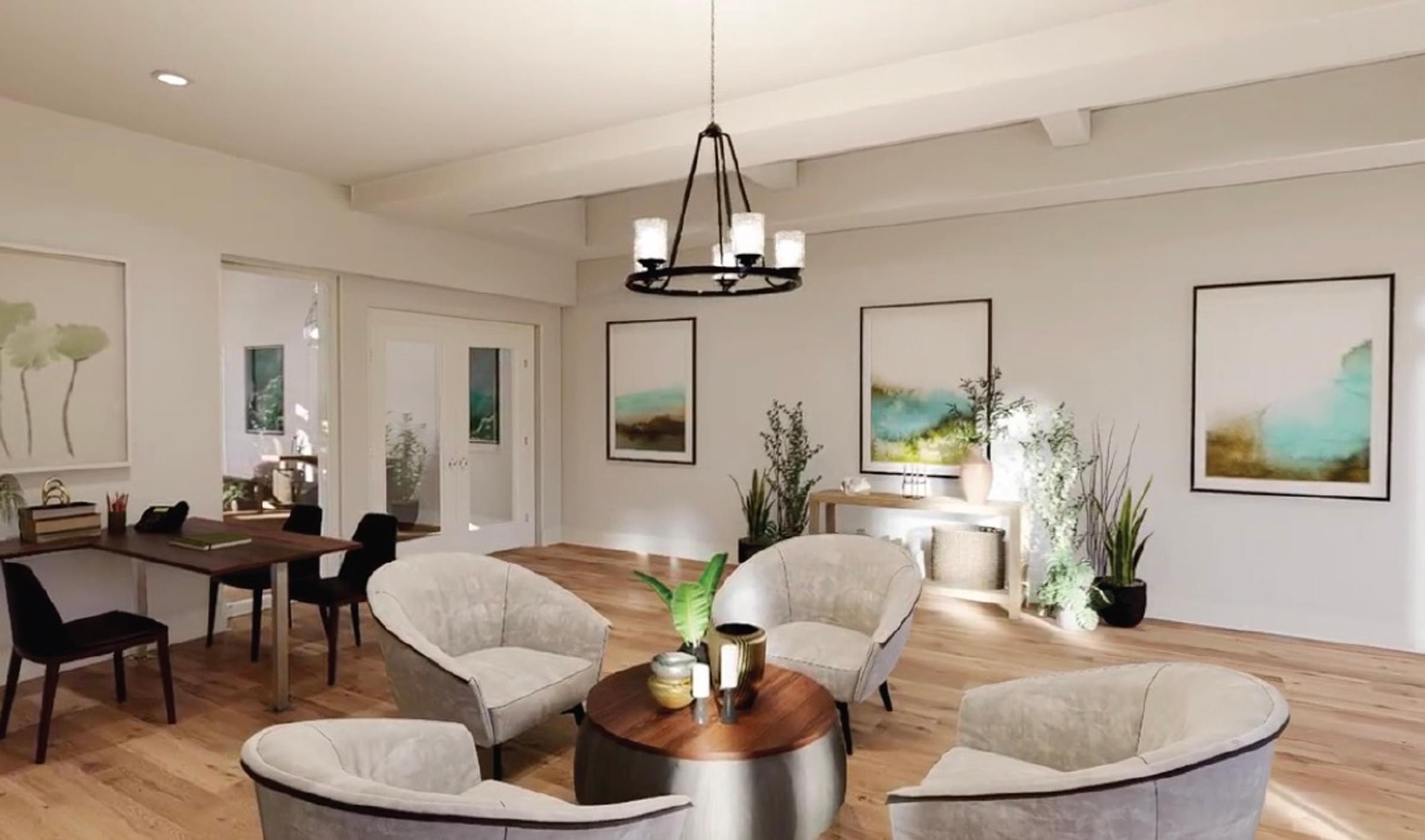 A modern living room with a dining area and a kitchen.