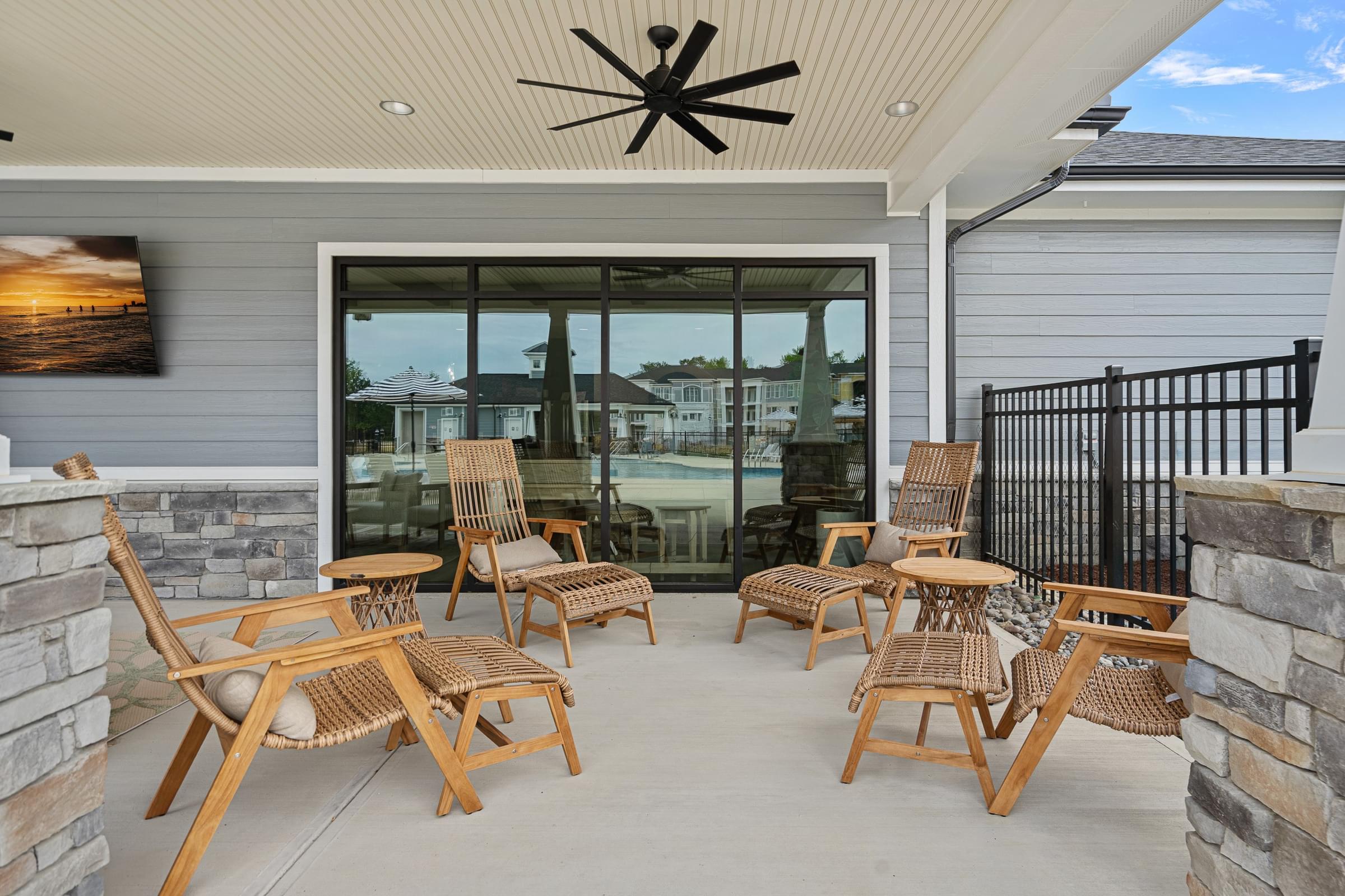 A patio with a set of chairs and a table.